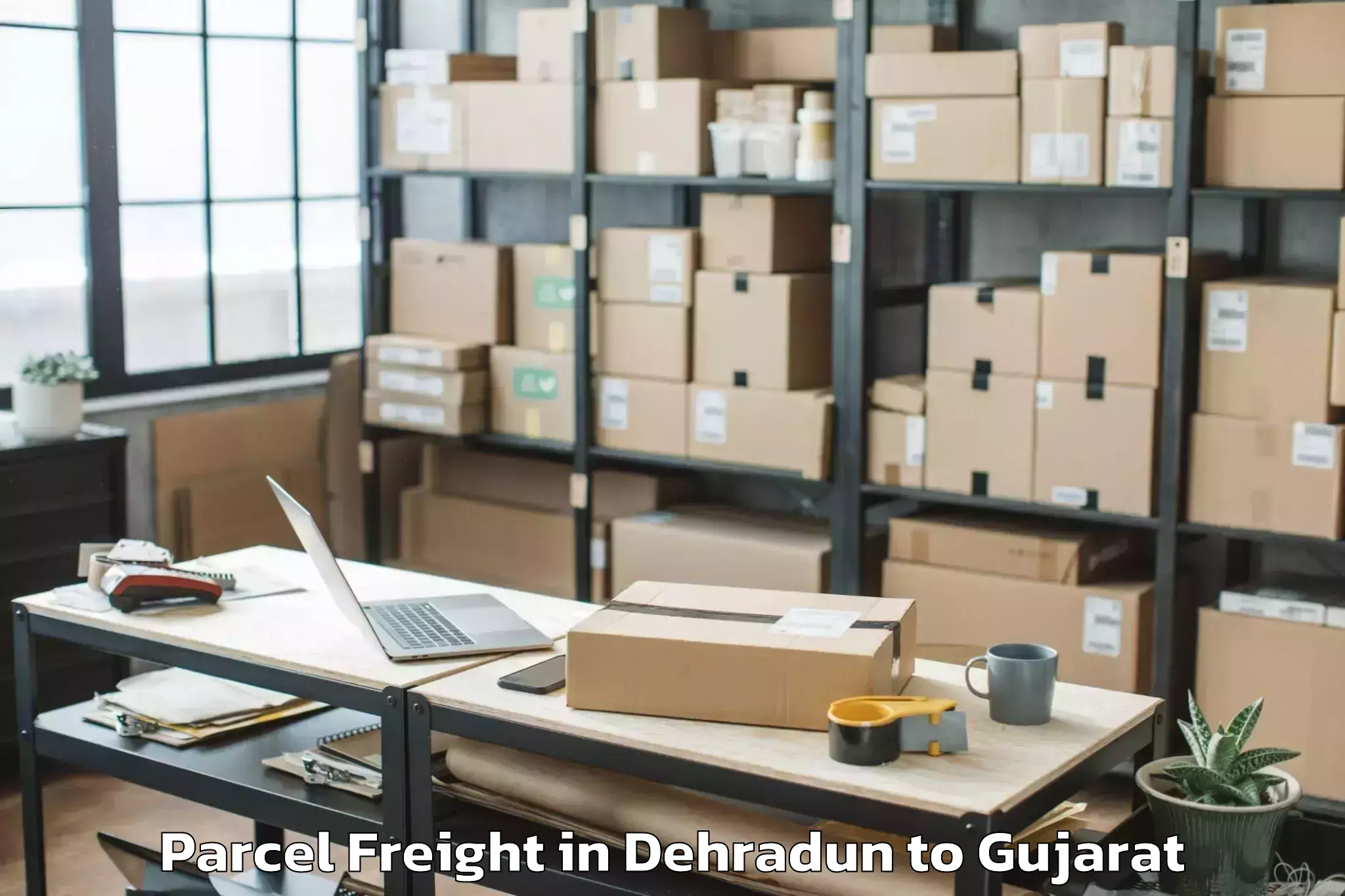 Discover Dehradun to Abhilashi University Ahmedabad Parcel Freight